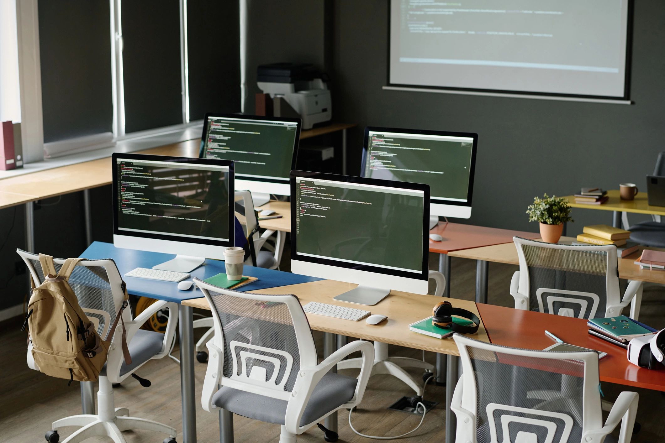 Software and analytics workspace with computer screens